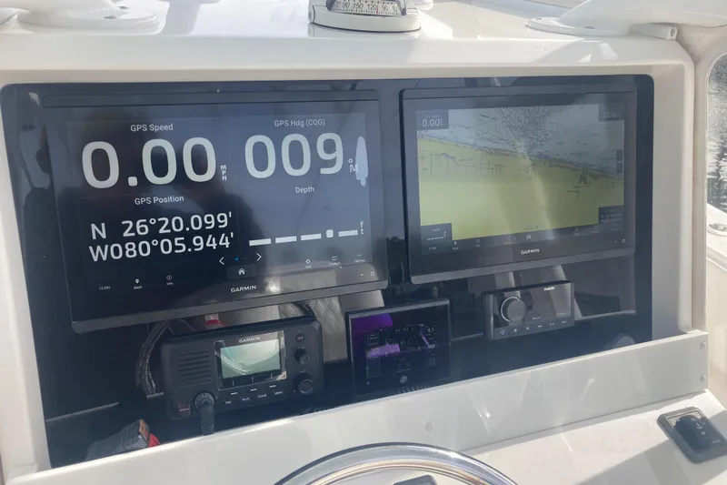 Sandtastic Yacht Photos Pics Dashboard of a 2020 Invincible 33 Open Fisherman with Garmin navigation displays.