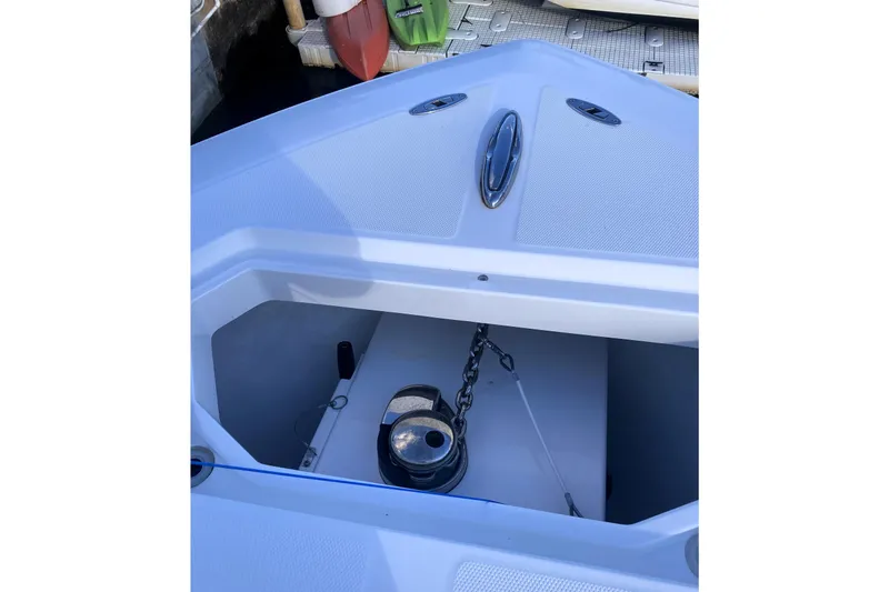 Sandtastic Yacht Photos Pics 2020 Invincible 33 Open Fisherman anchor locker with chain and winch.