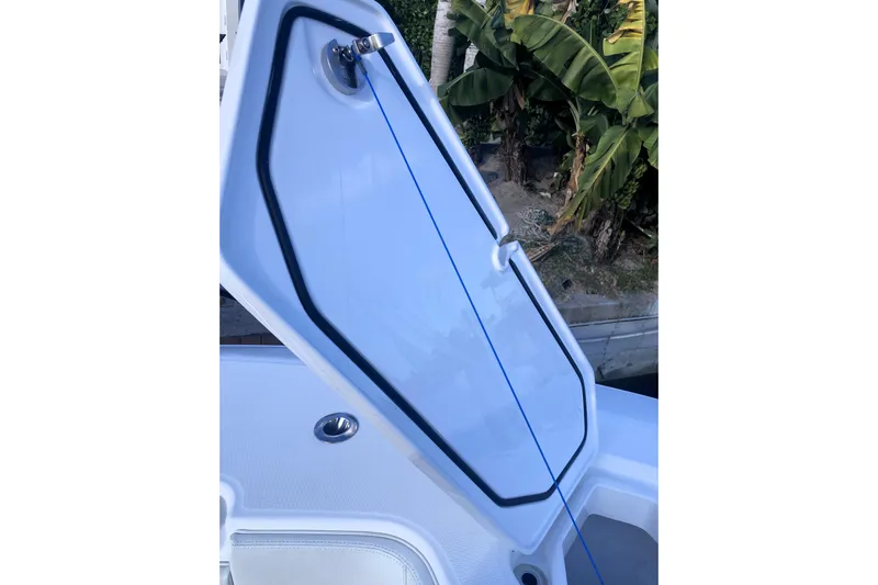 Sandtastic Yacht Photos Pics 2020 Invincible 33 Open Fisherman boat hatch open, showcasing interior details.