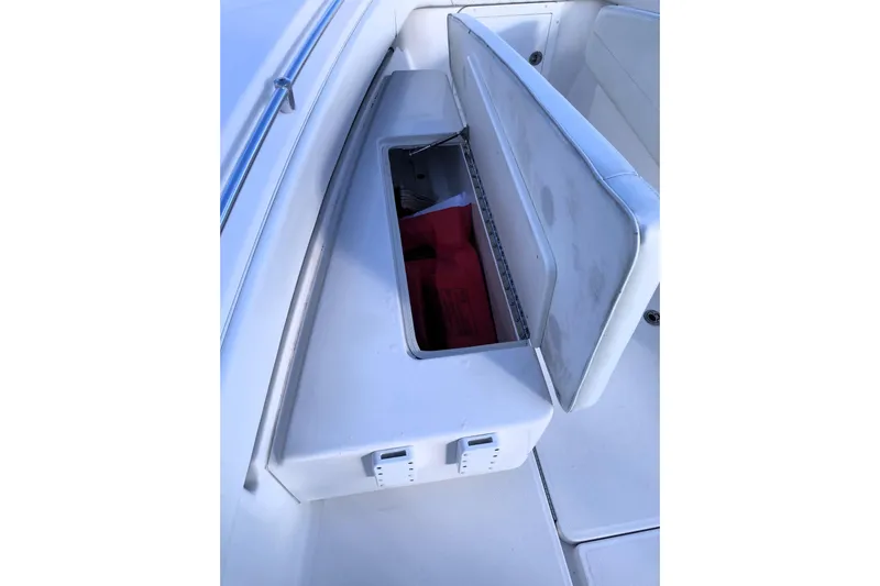 Sandtastic Yacht Photos Pics 2020 Invincible 33 Open Fisherman boat storage compartment with open lid.