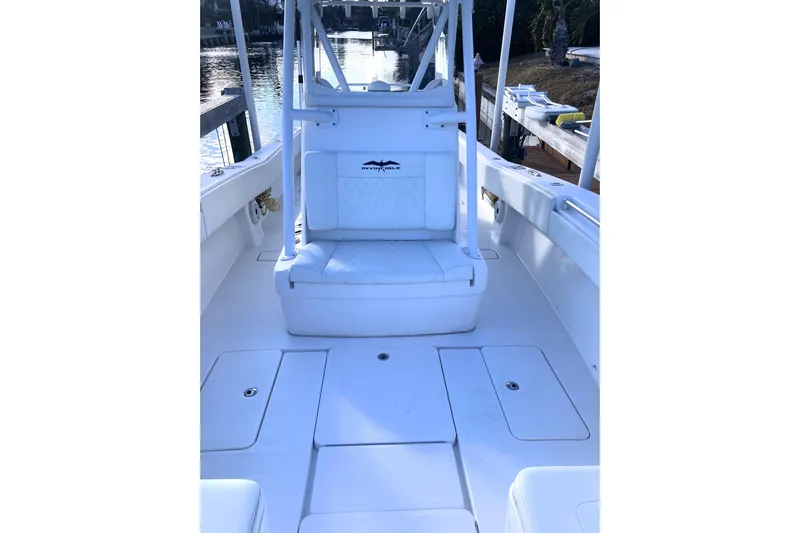 Sandtastic Yacht Photos Pics 2020 Invincible 33 Open Fisherman boat interior with white seating and storage compartments.