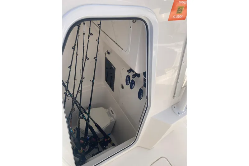 Sandtastic Yacht Photos Pics Interior view of 2020 Invincible 33 Open Fisherman boat with fishing rods and equipment.