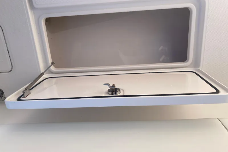 Sandtastic Yacht Photos Pics Open storage compartment on 2020 Invincible 33 Open Fisherman boat.