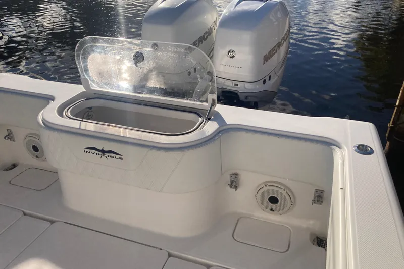 Sandtastic Yacht Photos Pics 2020 Invincible 33 Open Fisherman boat with dual Mercury engines on water.
