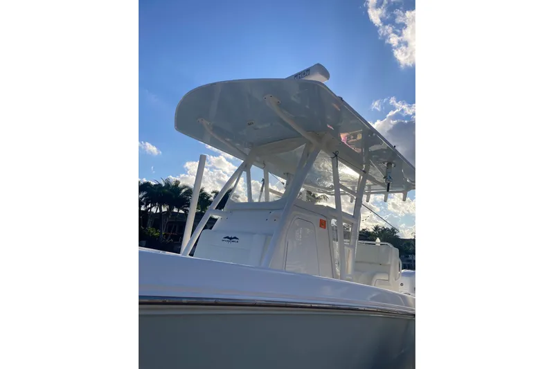 Sandtastic Yacht Photos Pics 2020 Invincible 33 Open Fisherman boat under a clear blue sky.