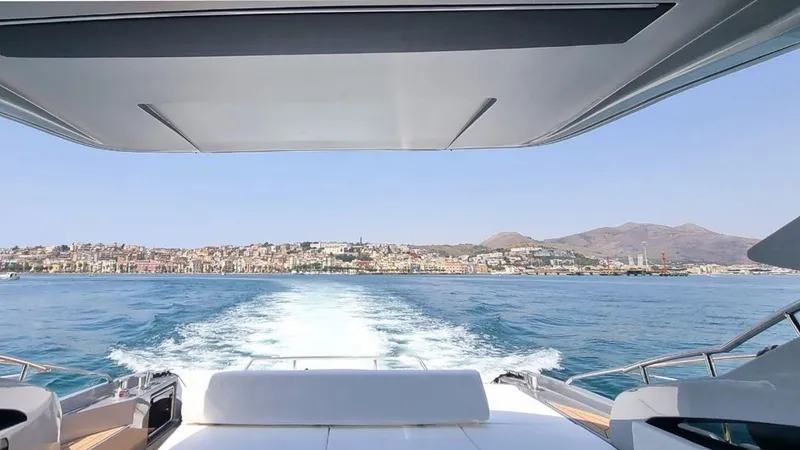  Yacht Photos Pics View from the Rizzardi In Five 2024 yacht, cruising on a clear blue sea.
