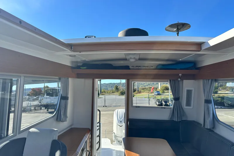  Yacht Photos Pics Interior of 2025 Sargo 31OB boat with seating and windows.