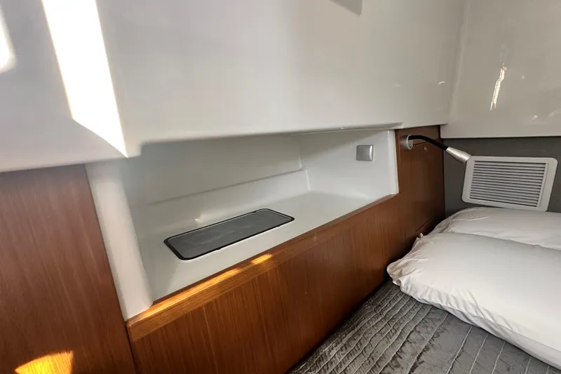  Yacht Photos Pics Interior cabin of 2025 Sargo 31OB boat with modern wood and white design.