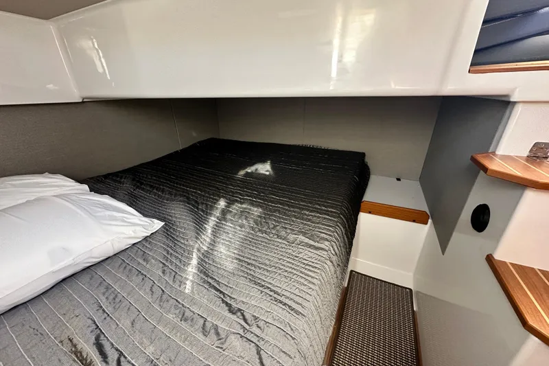  Yacht Photos Pics Cozy cabin interior of 2025 Sargo 31OB with comfortable bedding and modern design.