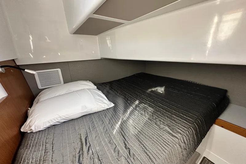  Yacht Photos Pics Cozy cabin interior of 2025 Sargo 31OB with a neatly made bed.