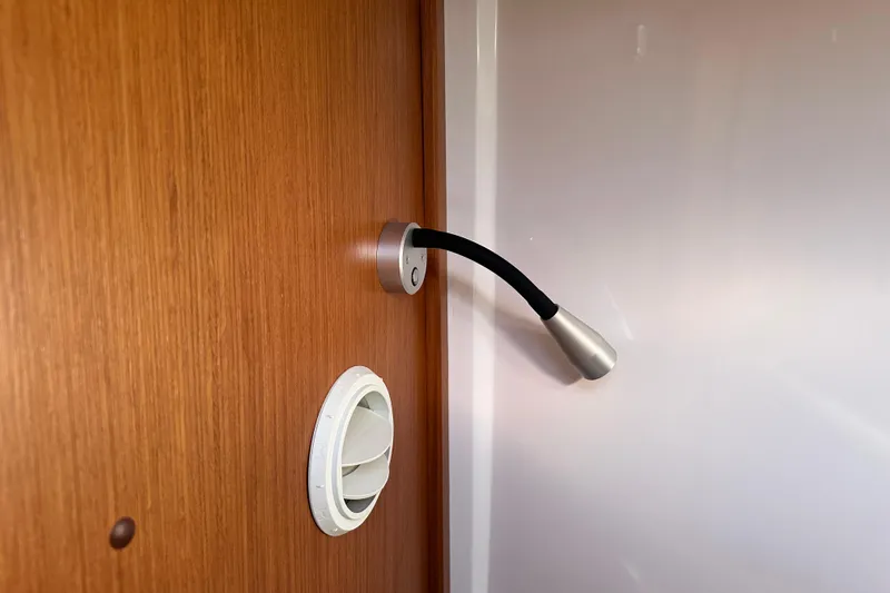  Yacht Photos Pics Flexible reading light and air vent on Sargo 31OB 2025 wooden interior.