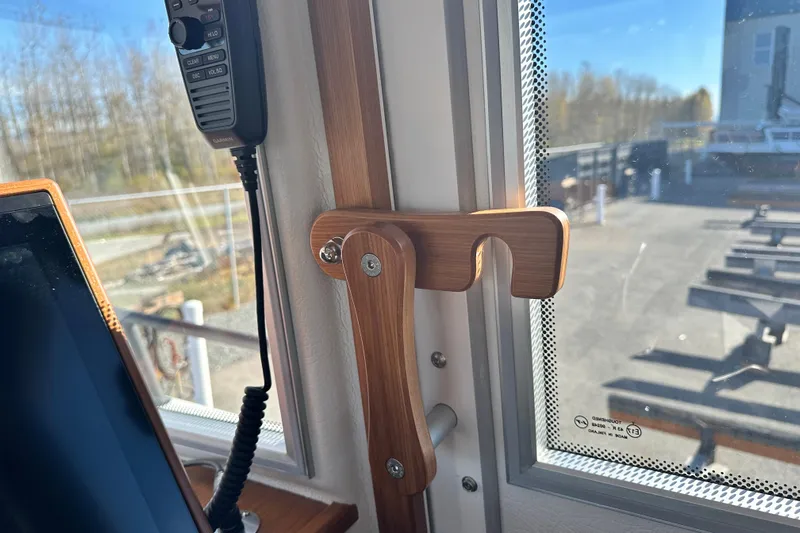 Yacht Photos Pics Interior of 2025 Sargo 31OB boat with wooden handle and communication device.
