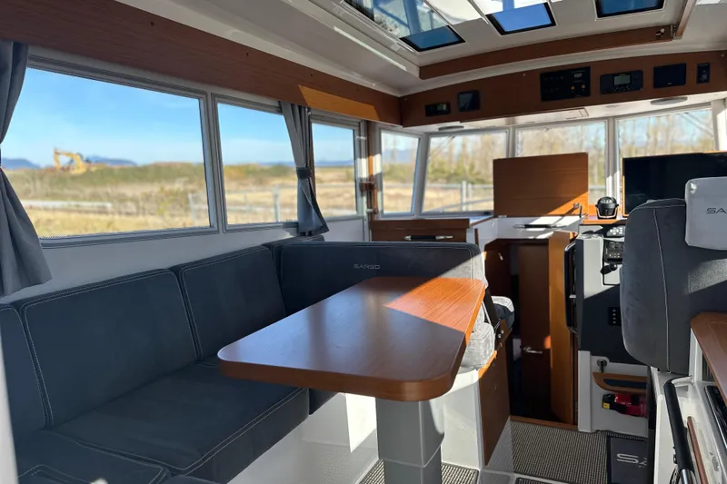  Yacht Photos Pics Interior of 2025 Sargo 31OB boat with modern seating and panoramic windows.