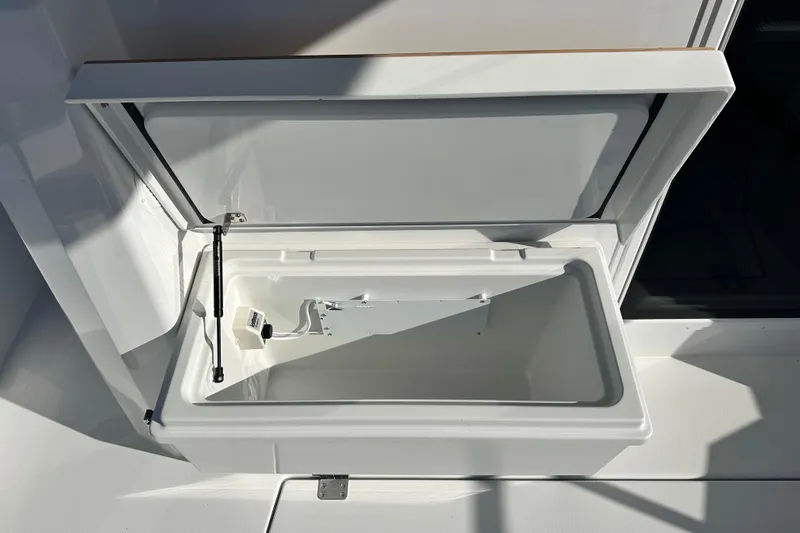  Yacht Photos Pics Open storage compartment on 2025 Sargo 31OB boat, showcasing interior details.