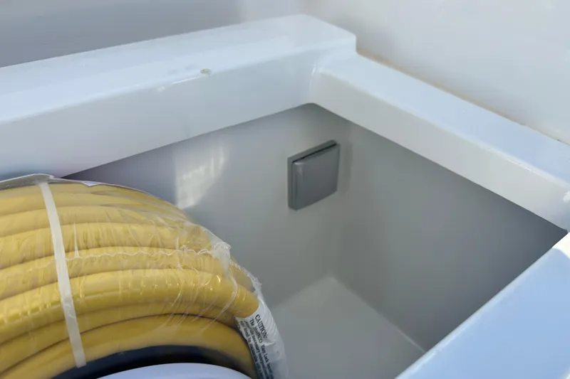  Yacht Photos Pics Storage compartment with yellow hose in 2025 Sargo 31OB boat.