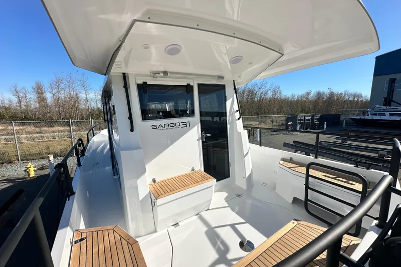  Yacht Photos Pics 2025 Sargo 31OB boat deck with seating, showcasing modern design and outdoor space.