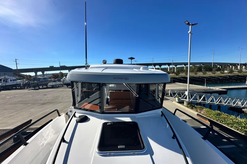  Yacht Photos Pics 2025 Sargo 31OB boat docked at marina under clear blue sky.