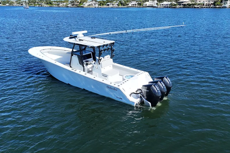  Yacht Photos Pics 2021 Onslow Bay 33 Tournament boat on calm water with triple outboard engines.