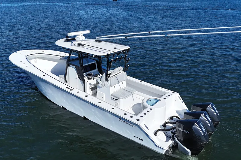  Yacht Photos Pics 2021 Onslow Bay 33 Tournament boat on water with triple Mercury engines.