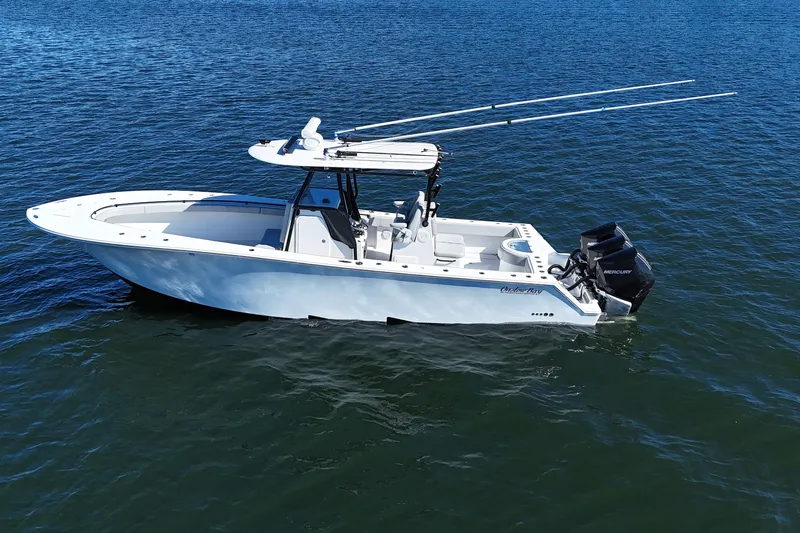  Yacht Photos Pics 2021 Onslow Bay 33 Tournament boat on calm water, featuring dual Mercury engines.