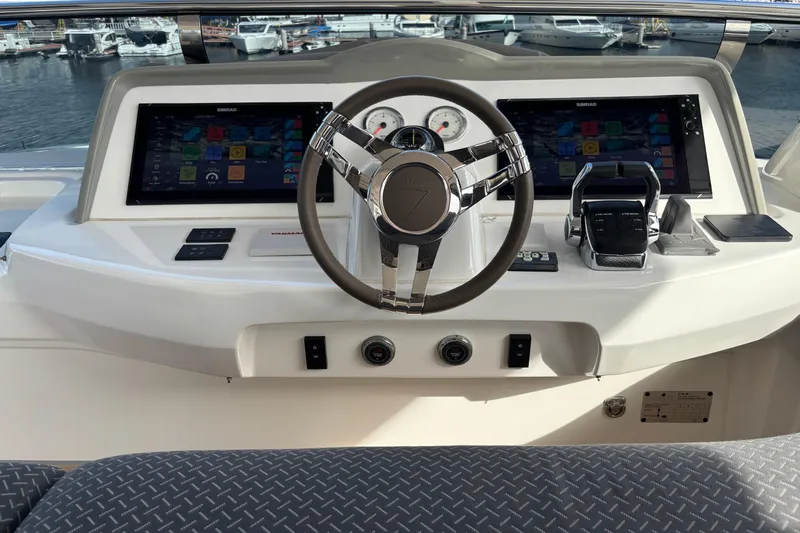 Sixty7 Yacht Photos Pics Helm of 2023 Lagoon SIXTY 7 yacht with modern navigation displays and controls.