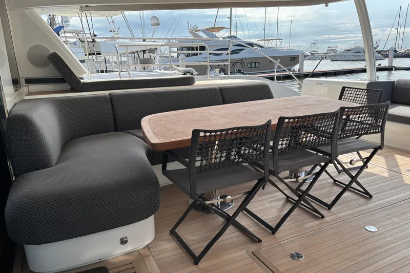 Sixty7 Yacht Photos Pics Luxurious 2023 Lagoon SIXTY 7 yacht deck with elegant seating and dining area.