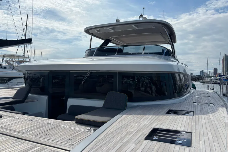 Sixty7 Yacht Photos Pics 2023 Lagoon SIXTY 7 yacht docked, showcasing sleek design and spacious deck.