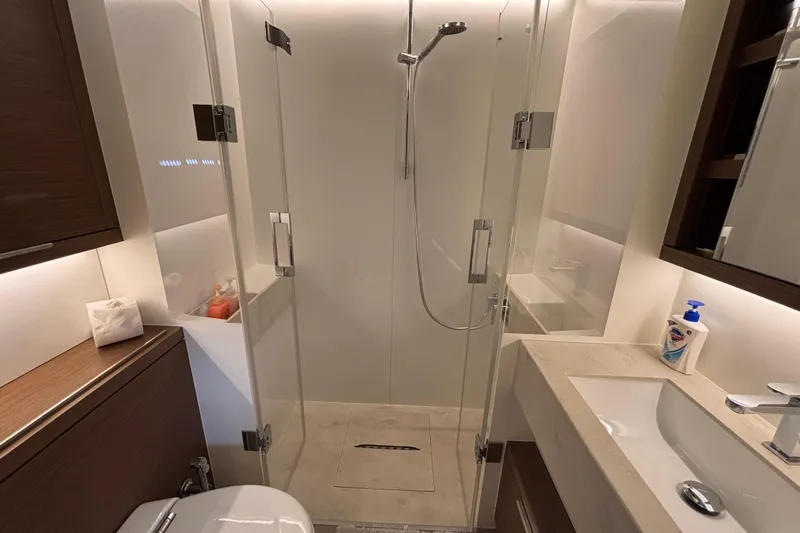 Sixty7 Yacht Photos Pics Luxurious bathroom in 2023 Lagoon SIXTY 7 yacht with modern shower and elegant fixtures.