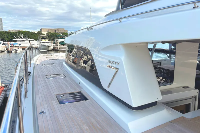 Sixty7 Yacht Photos Pics 2023 Lagoon SIXTY 7 yacht docked at marina, showcasing sleek design and spacious deck.