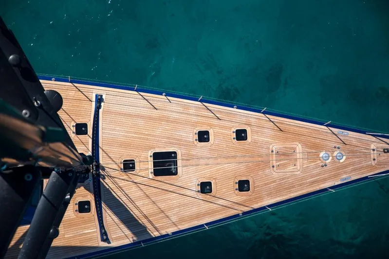  Yacht Photos Pics Aerial view of Wally 94' yacht deck, 2005 model, on clear blue water.