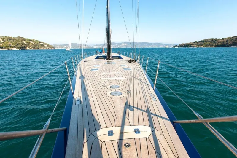  Yacht Photos Pics Luxurious 2005 Wally 94' yacht sailing on clear blue waters.