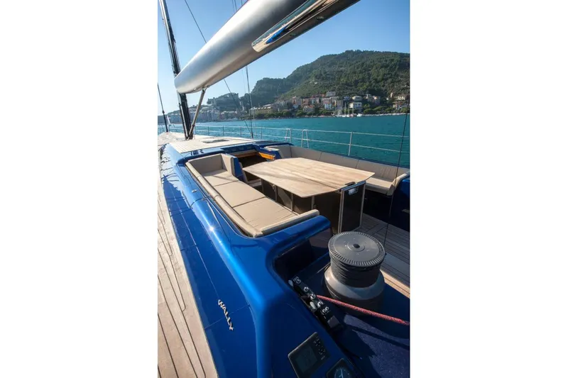  Yacht Photos Pics Luxurious 2005 Wally 94' yacht with sleek blue deck and elegant seating area.