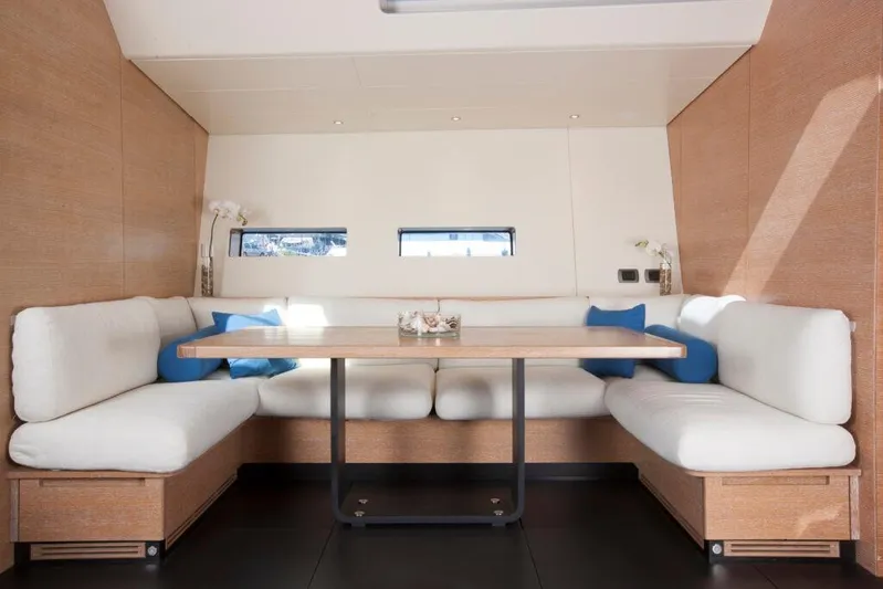  Yacht Photos Pics Luxurious interior of 2005 Wally WALLY 94' yacht with elegant seating and table.