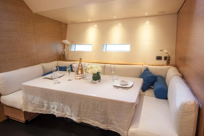  Yacht Photos Pics Luxurious dining area on 2005 Wally WALLY 94' yacht with elegant table setting.