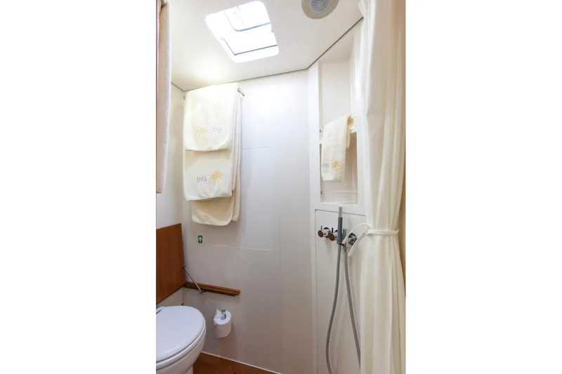  Yacht Photos Pics Bathroom interior of 2005 Wally WALLY 94' yacht with towels and shower.