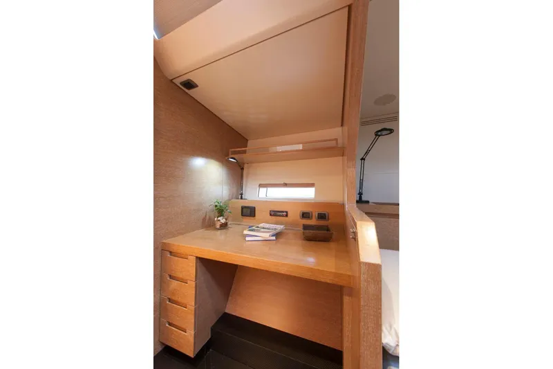  Yacht Photos Pics Luxurious wooden desk area inside a 2005 Wally WALLY 94' yacht cabin.