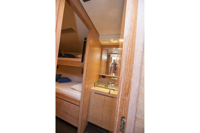  Yacht Photos Pics Interior of 2005 Wally WALLY 94' yacht with wooden bunk beds and compact bathroom.