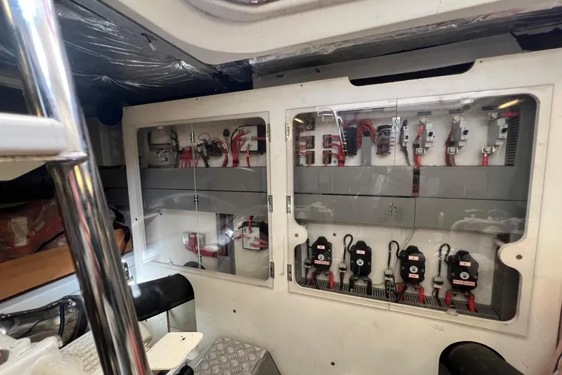  Yacht Photos Pics Electrical panel inside a 2013 Prestige 620 yacht, showcasing wiring and circuit breakers.