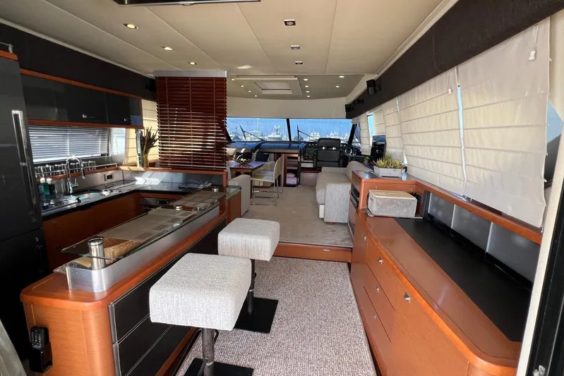  Yacht Photos Pics Luxurious interior of a 2013 Prestige 620 yacht with modern kitchen and seating area.