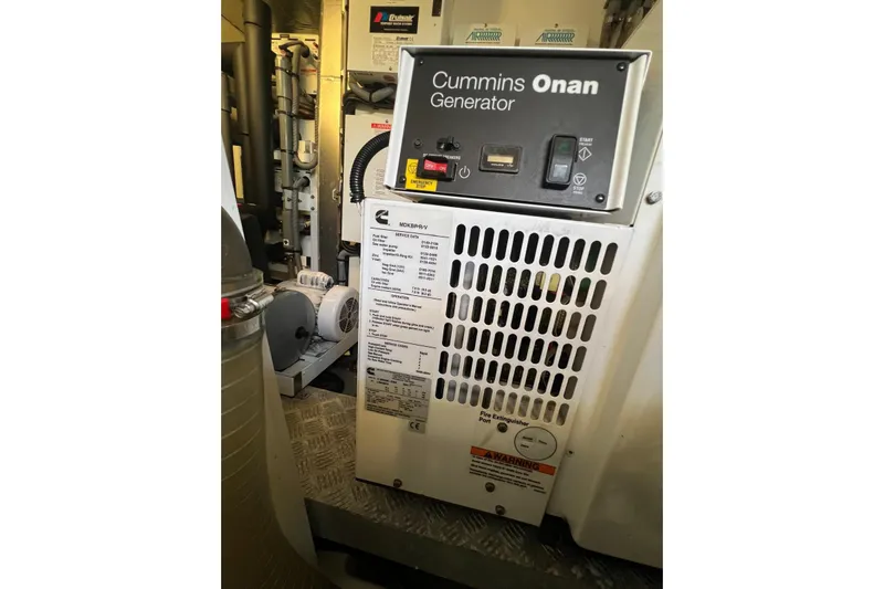  Yacht Photos Pics Cummins Onan generator in a 2013 Prestige 620 yacht engine room.