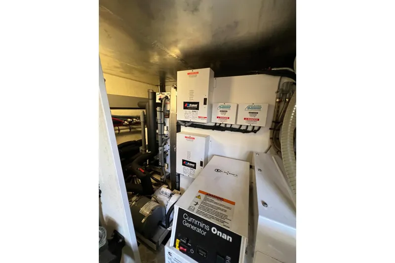  Yacht Photos Pics Engine room of 2013 Prestige 620 yacht with Cummins Onan generator and electrical panels.