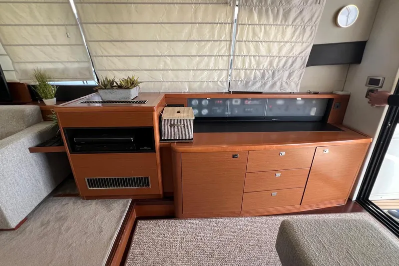  Yacht Photos Pics Luxurious interior of a 2013 Prestige 620 yacht with elegant wood cabinetry and modern decor.