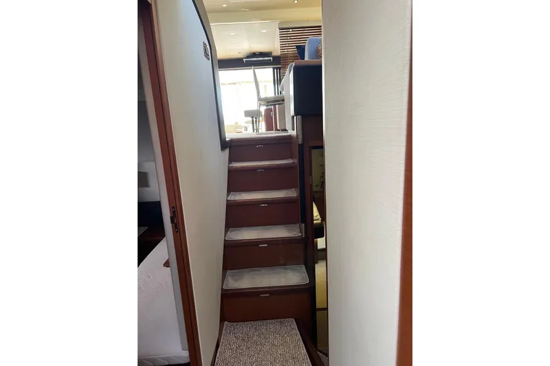 Yacht Photos Pics Interior staircase of 2013 Prestige 620 yacht, leading to upper deck.