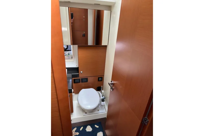  Yacht Photos Pics Bathroom interior of 2013 Prestige 620 yacht with wooden finishes and modern amenities.