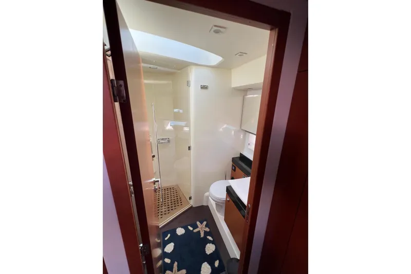  Yacht Photos Pics Luxurious bathroom interior of 2013 Prestige 620 yacht, featuring modern fixtures and elegant design.