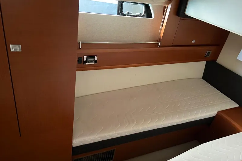  Yacht Photos Pics Interior cabin of 2013 Prestige 620 yacht with wooden finish and single bed.