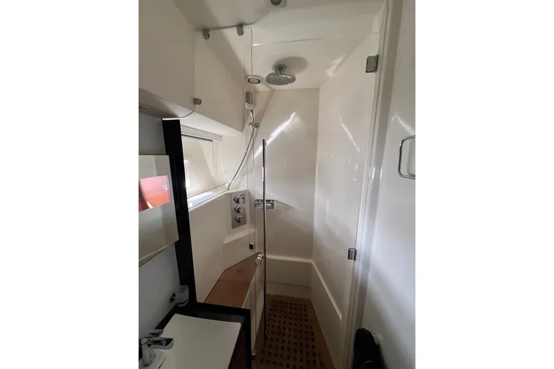  Yacht Photos Pics Luxurious bathroom in 2013 Prestige 620 yacht with modern fixtures and glass shower.