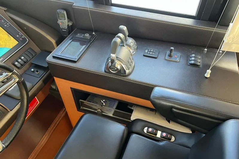  Yacht Photos Pics Cockpit controls of a 2013 Prestige 620 yacht, featuring navigation and communication equipment.