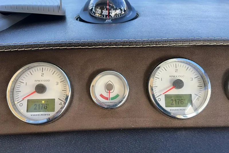  Yacht Photos Pics Dashboard of 2013 Prestige 620 boat with Volvo Penta gauges and compass.