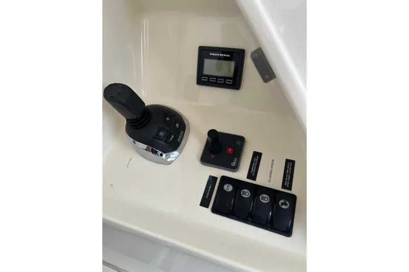  Yacht Photos Pics Control panel of a 2013 Prestige 620 yacht with joystick and Volvo Penta display.